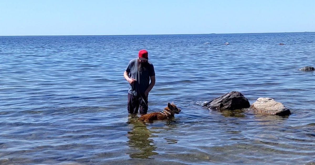 man in the lake with a dog | Awenda Provincial Park: Video Review